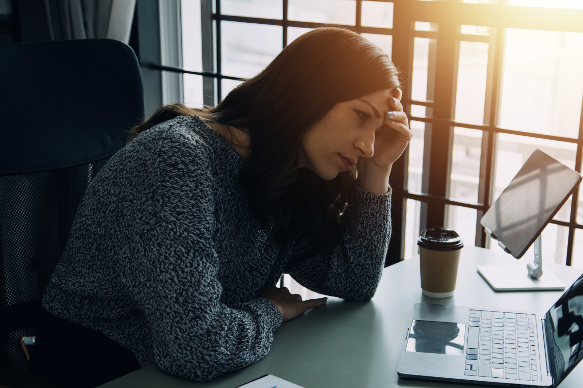 Frustarted woman looking at computer
